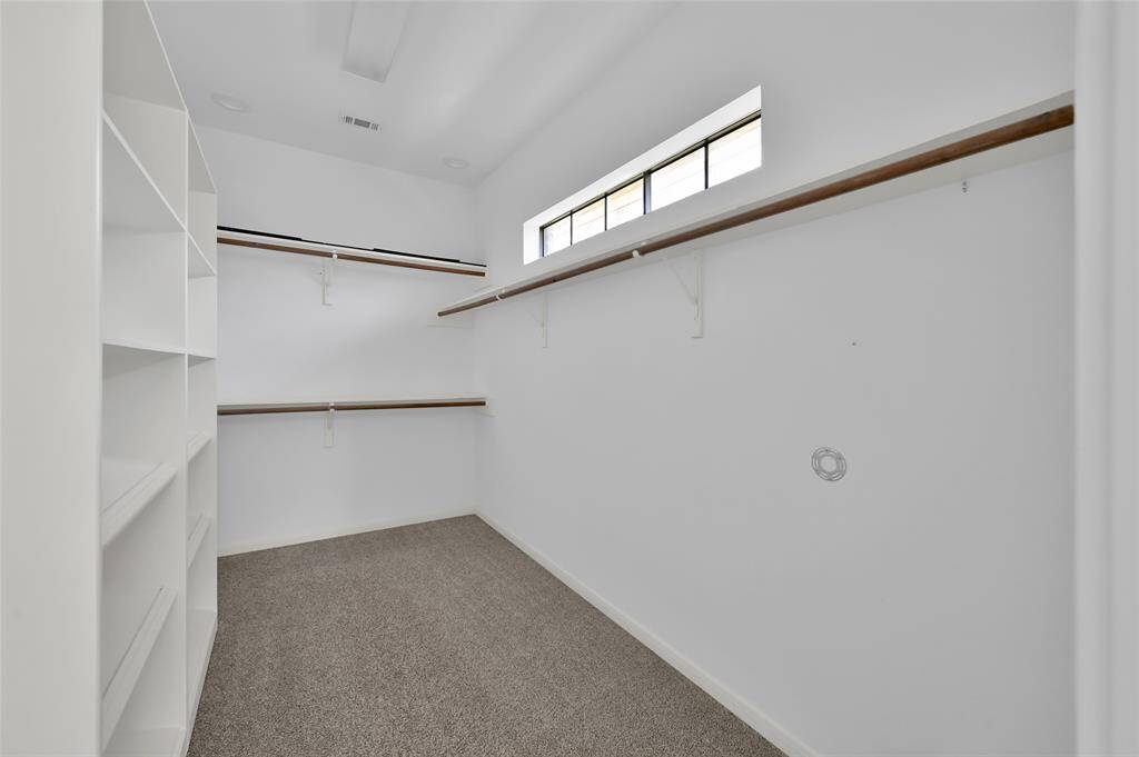 Huge walk-in closet with windows