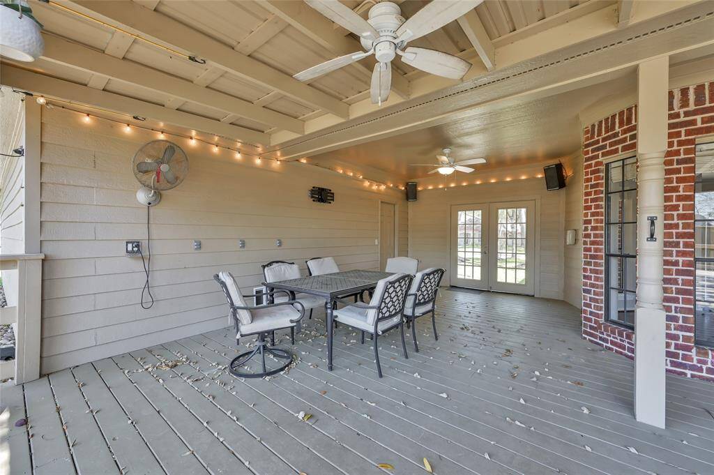 Covered patio with French Doors leading to the homes front exterior.