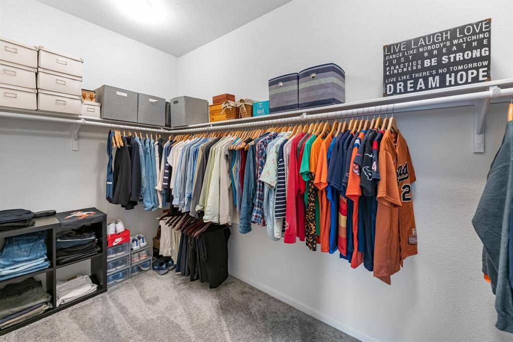 Look how spacious the primary closet is!