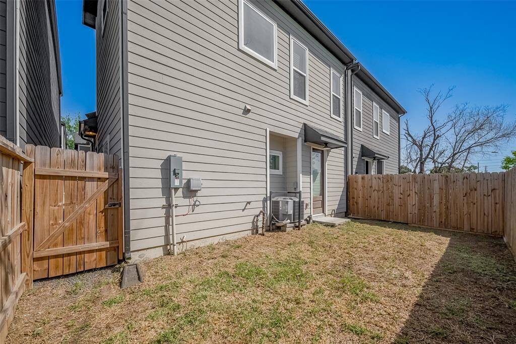 This fenced in backyard offers the perfect balance of privacy and space with a gated entry, fenced perimeter, and plenty of room for outdoor dining, pets, or playtime.