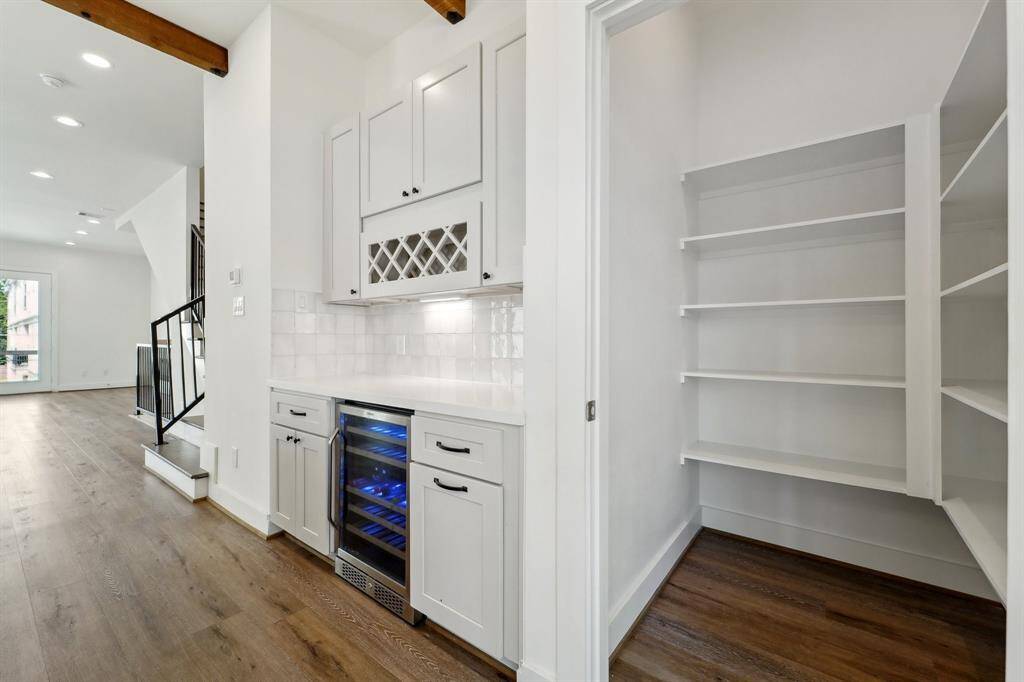 Large walk-in pantry and wine bar with built-in wine chiller!
