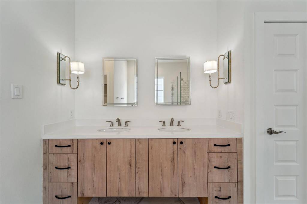 Dual vanity with an LED backlit frame-less mirrors.
