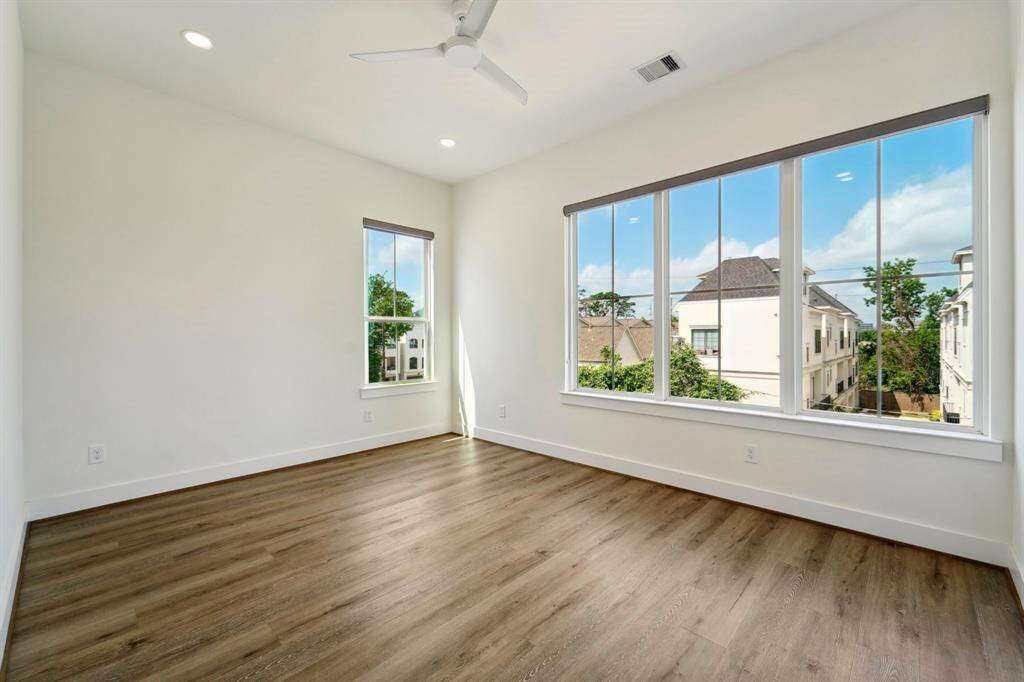 3rd bedroom with wall of windows for plenty of natural light.
