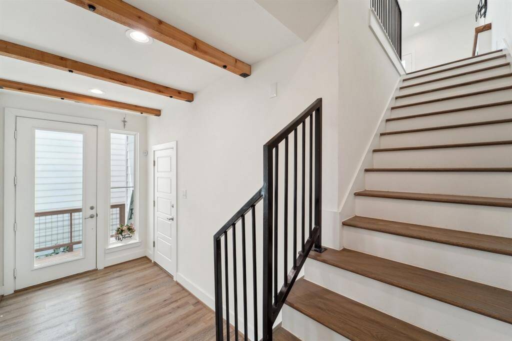 Stairs to 2nd floor living and dining space.
