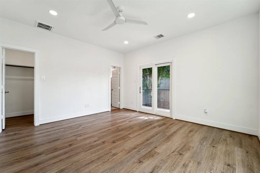 1st floor bedroom with ensuite bathroom and access to outdoor living space.