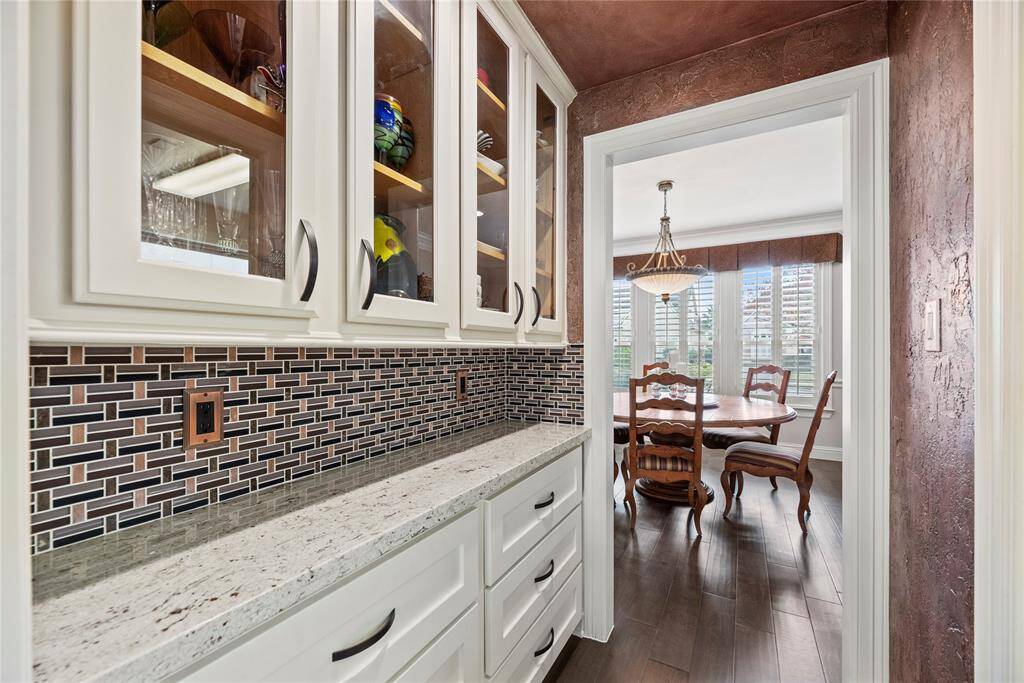 Butler's Pantry makes for a luxurious transition to the formal dining room. Every space has been intentionally created with entertaining in mind!
