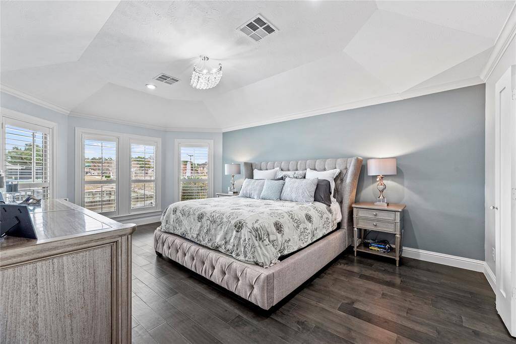 This spacious owner’s retreat is a beautiful space to begin and end your day. This suite is complete with a massive custom walk-in closet and a luxurious ensuite bathroom.