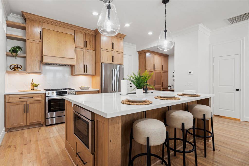 Large island with built in microwave and plenty of storage.