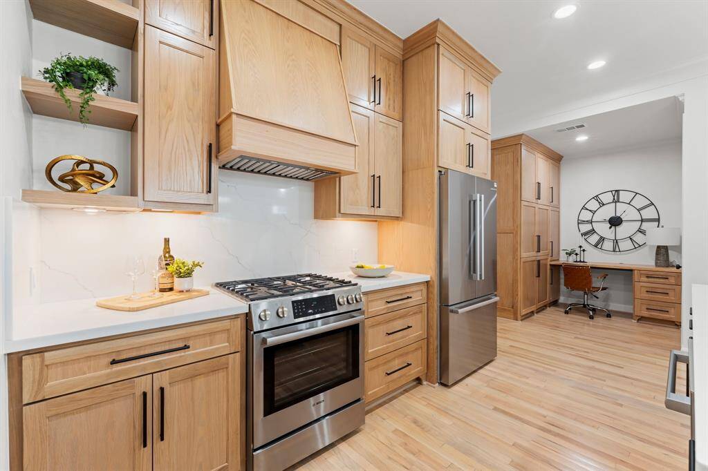 Custom white oak cabinets with quartz countertops and backsplash