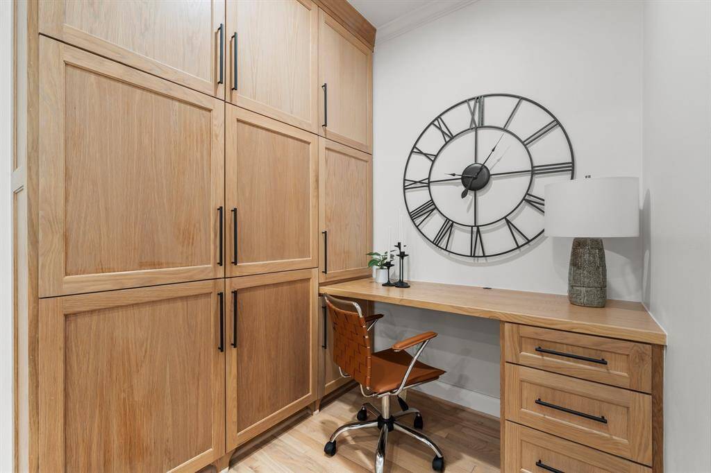 Ample storage and pull out cabinets with built in desk.