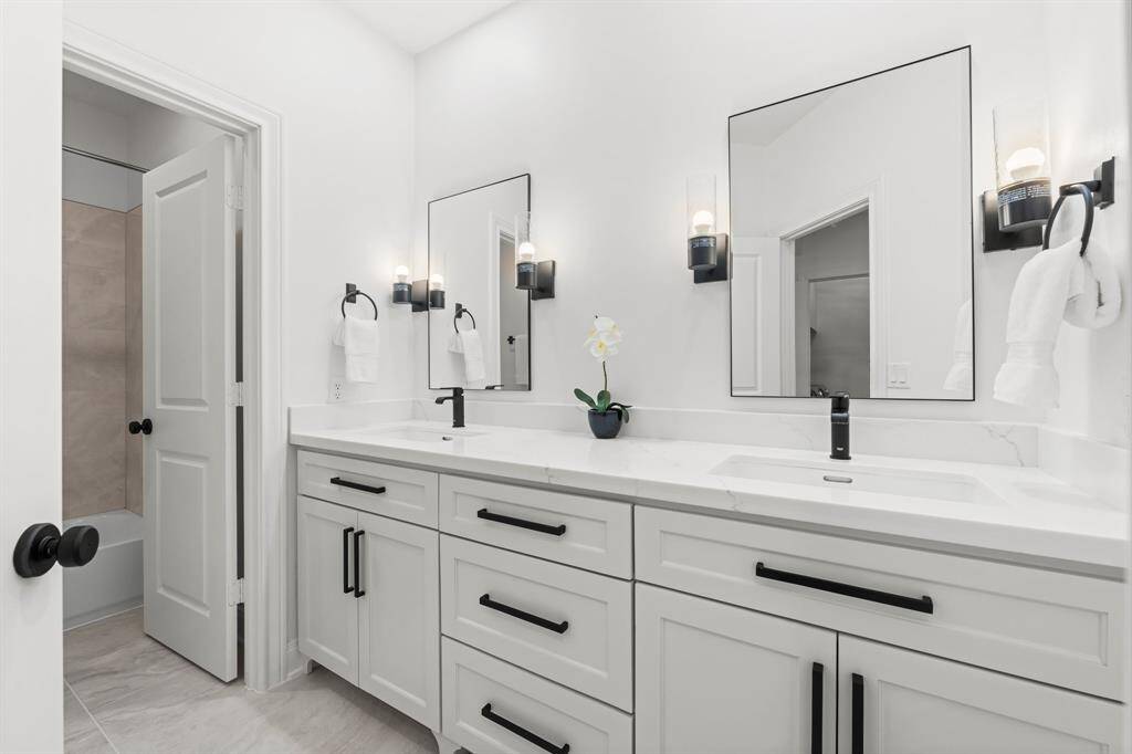 Light and bright secondary bathroom.