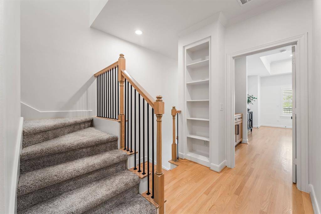Newly carpeting stairs leading up to the third floor bonus room