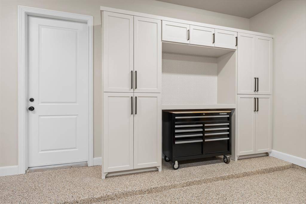 Epoxy floors and custom builtins provide sleek and stylish storage