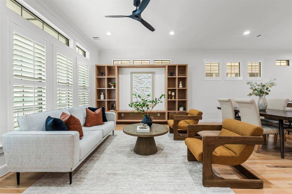 Custom builtins and a light and bright neutral palette ground this living space.