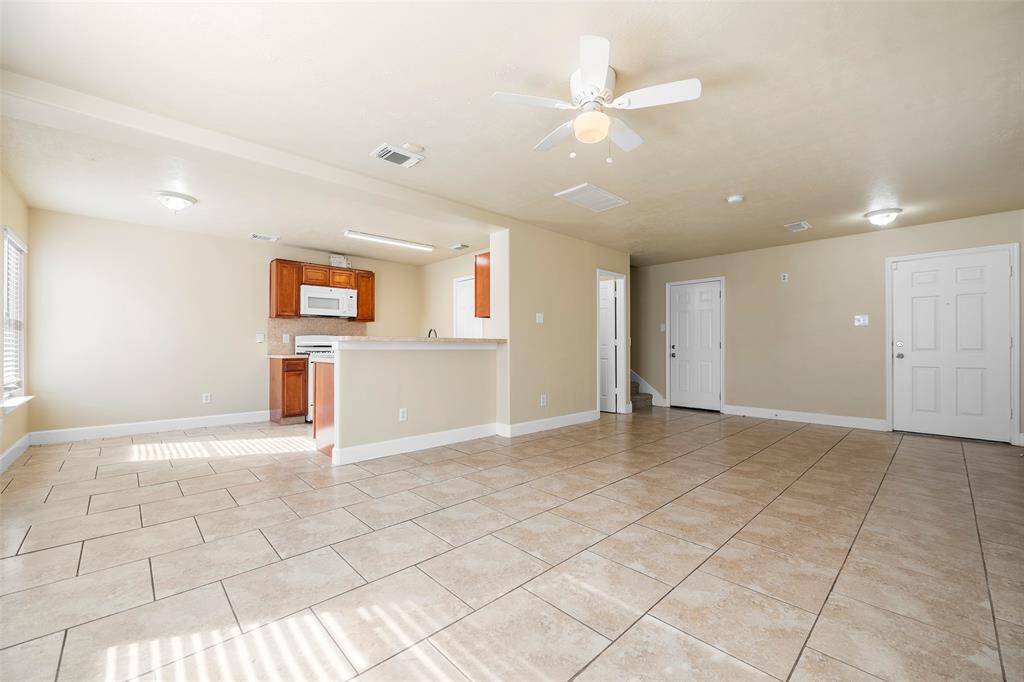 Spacious family room open to the family room, but not the front door.