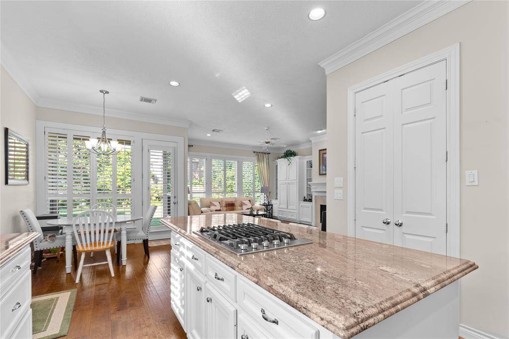 The kitchen is thoughtfully designed to overlook the living room, creating an open and inviting atmosphere that enhances the home's flow.