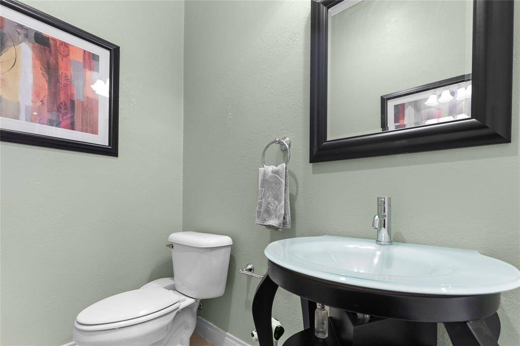 The powder room is elegantly simple, with focus on clean design and functionality
