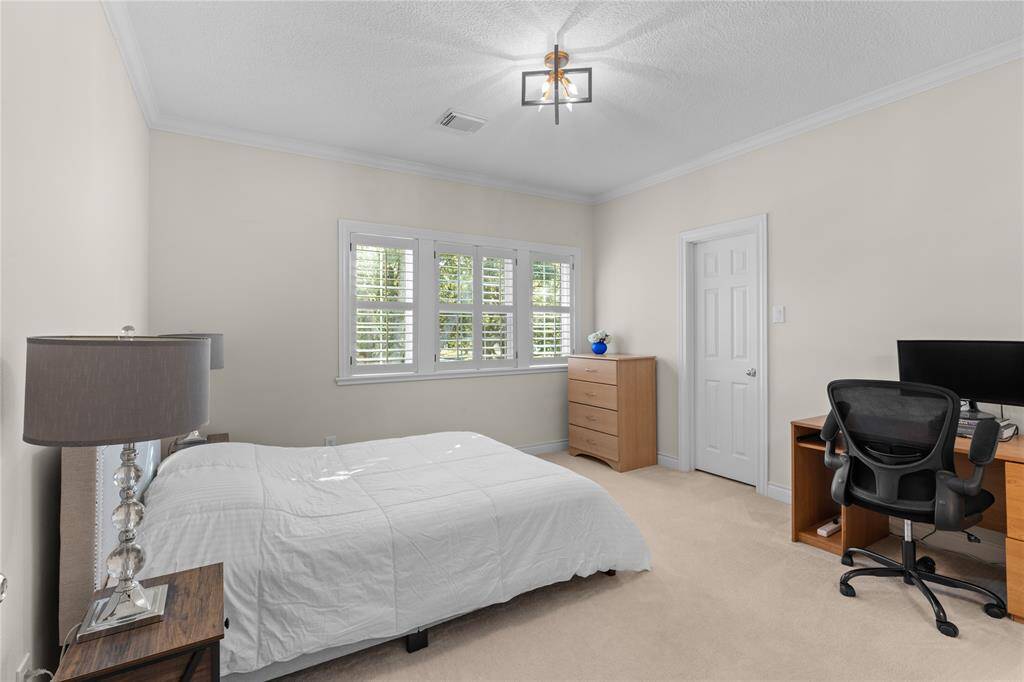 The 4th bedroom also has a large plantation shutters windows with plenty of natural light and high ceiling.