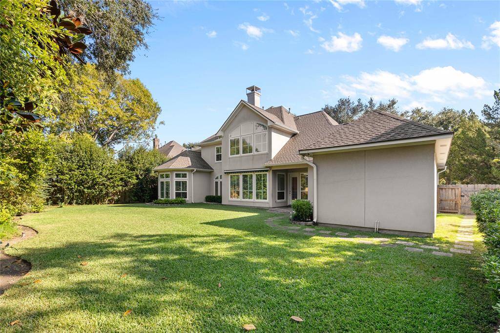 The oversized backyard is perfect for creating a private oasis and there's plenty of room for a full-size swimming pool.