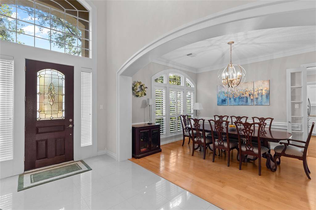 Inviting dining area with generous natural light, comfortably seats eight of more.