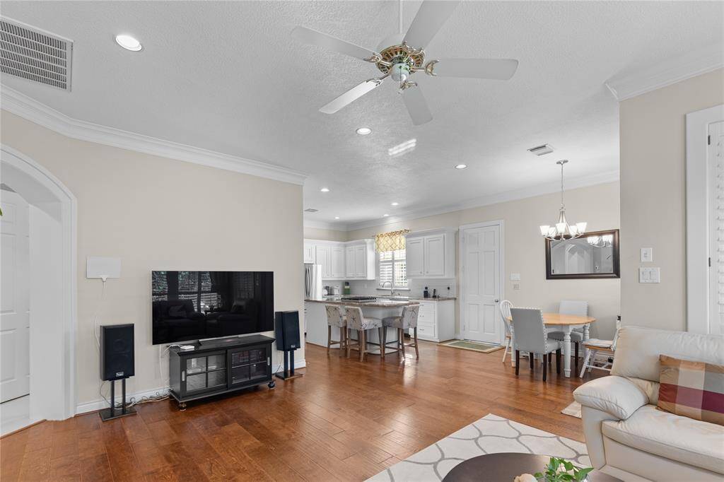 The kitchen, breakfast  and living room are seamlessly integrated, creating an open, inviting space perfect for both everyday living and entertainment.
