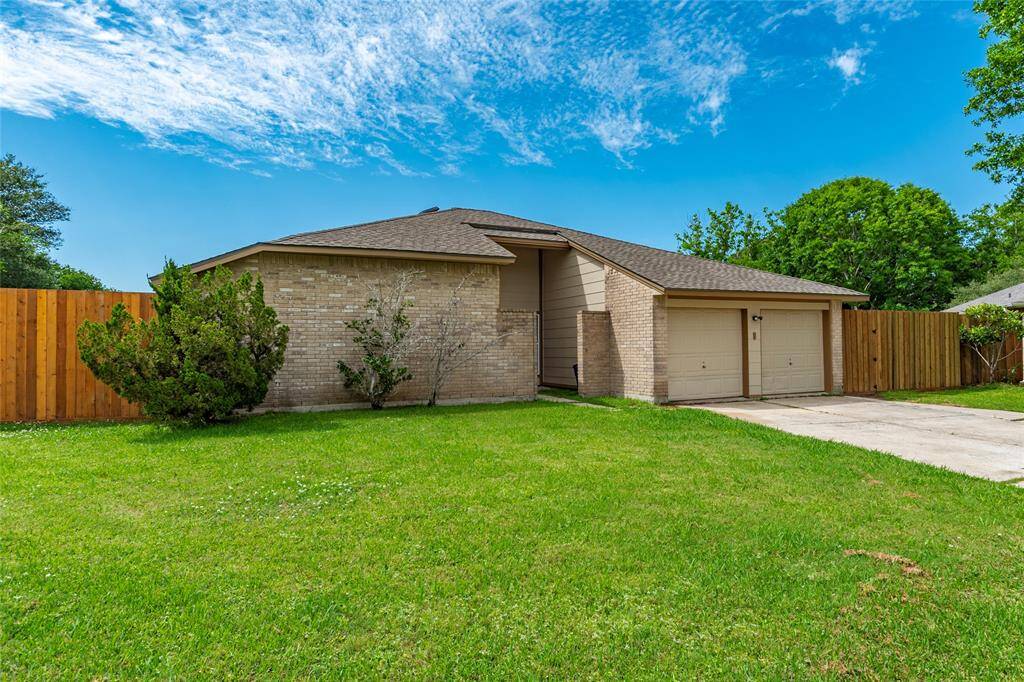 Large frontyard space. Two car attached garage with wide driveway.