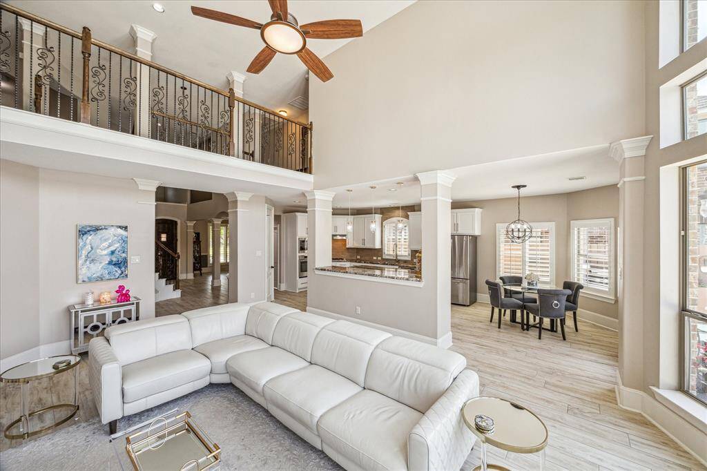 This spacious, open-concept kitchen and living area gives ease to entertaining. Enjoy the added convenience of extra cabinetry and counters in both the kitchen and living spaces.