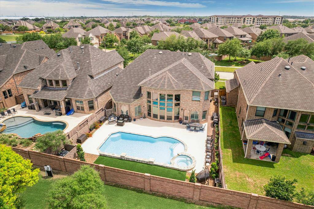 Aerial view of front of home in the Tuscan Lakes Community.