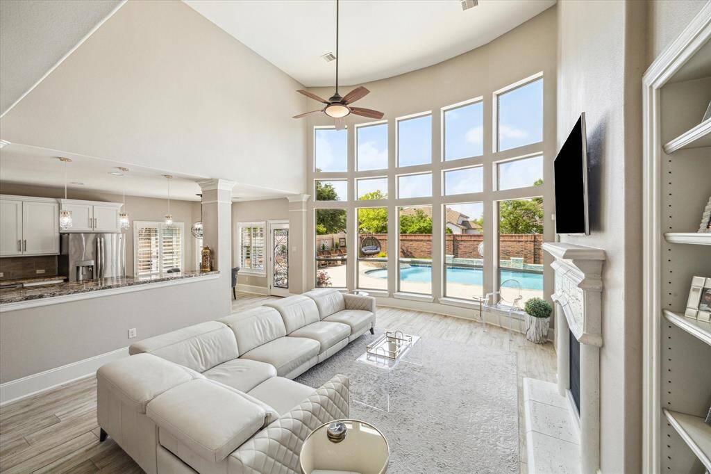This photo highlights the backyard view, featuring full brick on the back of the home and expansive windows. The area receives minimal direct sunlight, keeping it cool and comfortable.