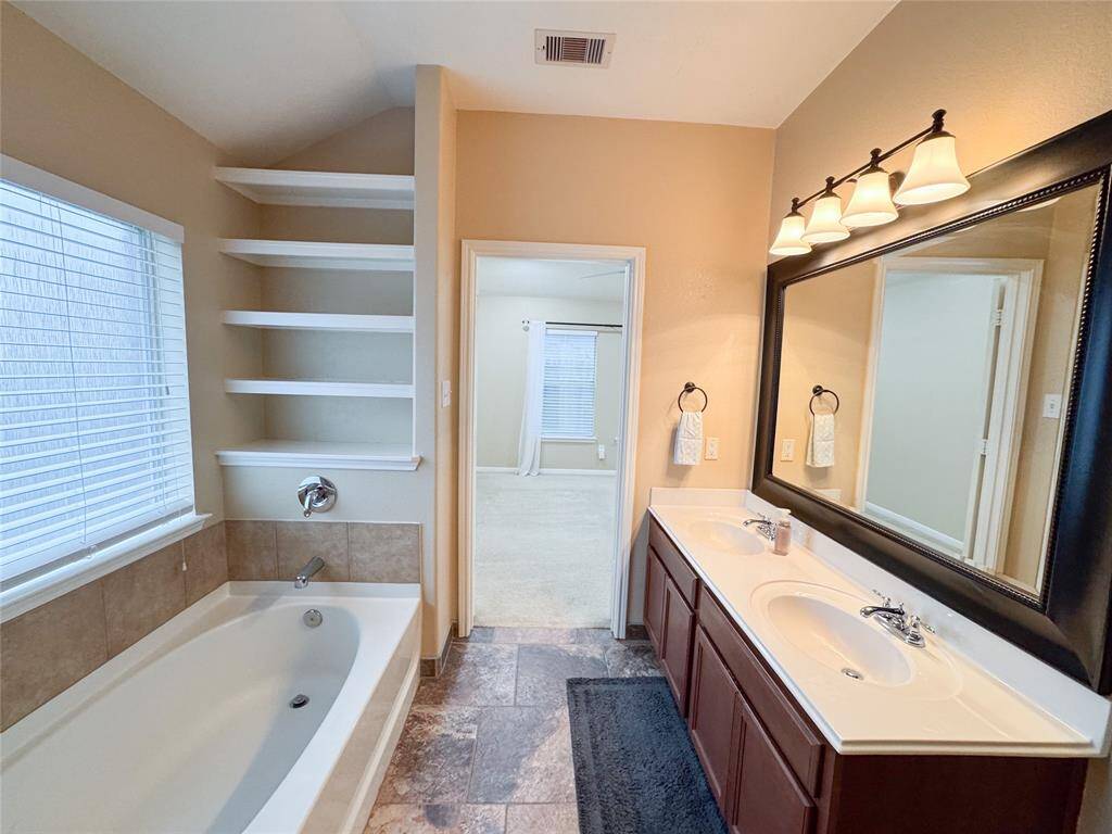 Primary bath and secondary bath both have built in shelves offering plenty of storage.