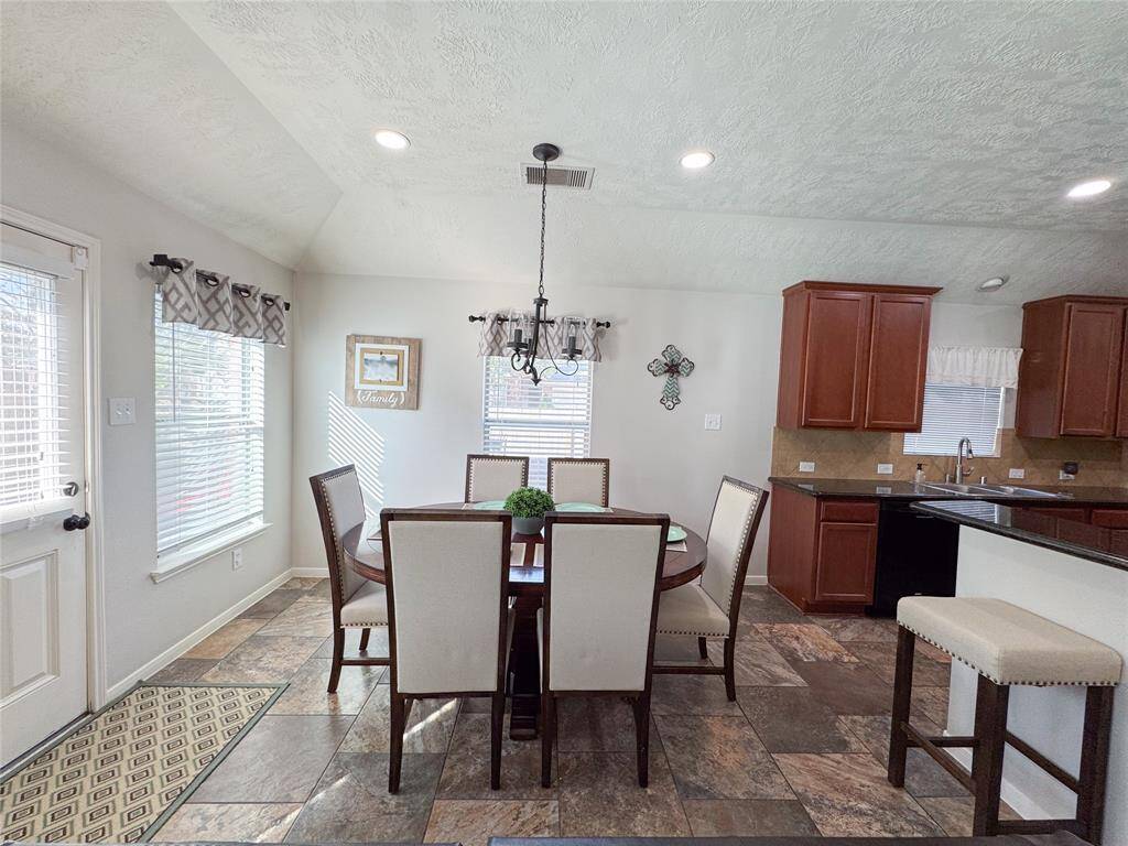Breakfast room off the kitchen with access to the back patio.