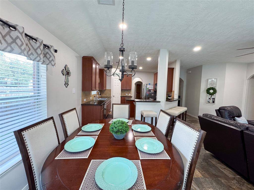 Breakfast room easily fits a large table for entertaining.