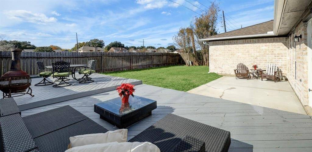 HUGE backyard, no back neighbors, lots of seating for family and friends to enjoy year around!