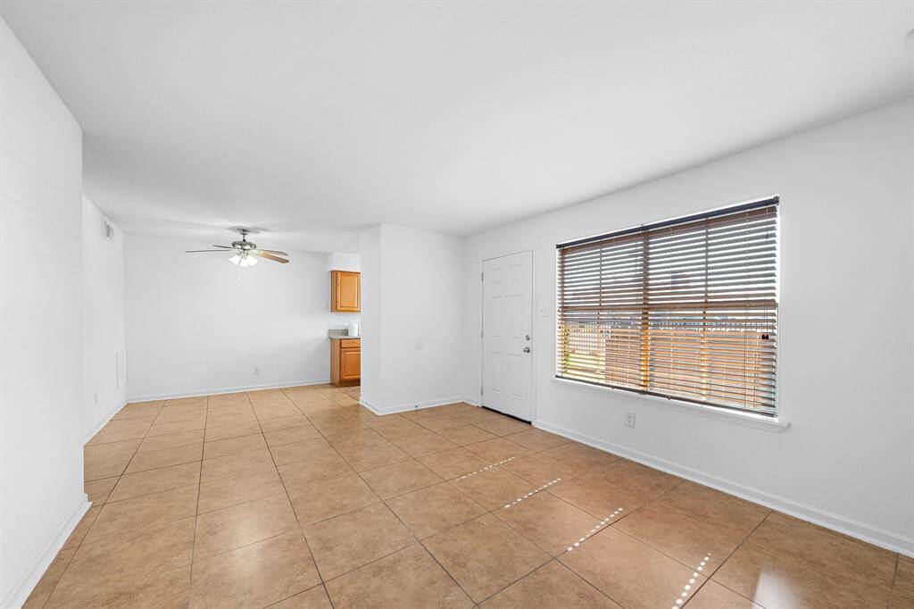 The living and dining areas have Fresh Paint, neutral Ceramic Tile flooring throughout, a Large Window in living room with nice Wooden Blinds that let in lots of natural light when open, a ceiling fan in dining room to keep the space extra cool, and modern fixtures and finishes!!