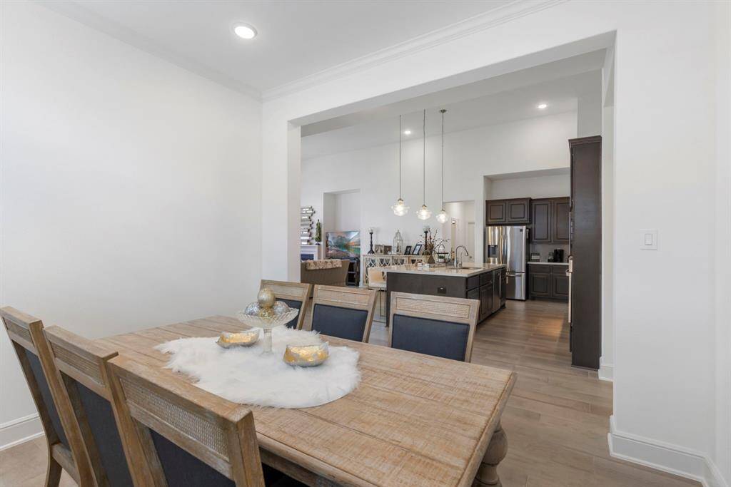 Open and near the kitchen for easy access to this lovely dining room.
