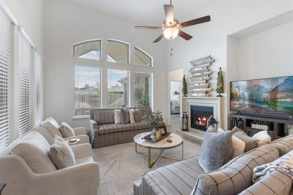 The most comfortable room is this light and bright family room, filled with natural sunlight streaming through large windows that overlook the backyard
