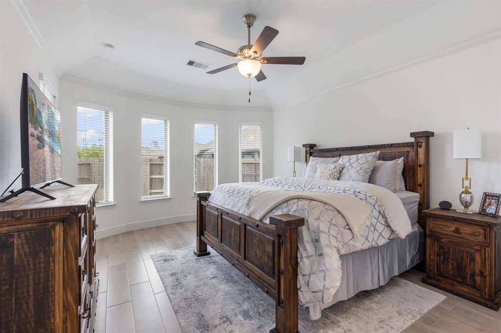 Large enough for king size bed and both nightstands with room left over!