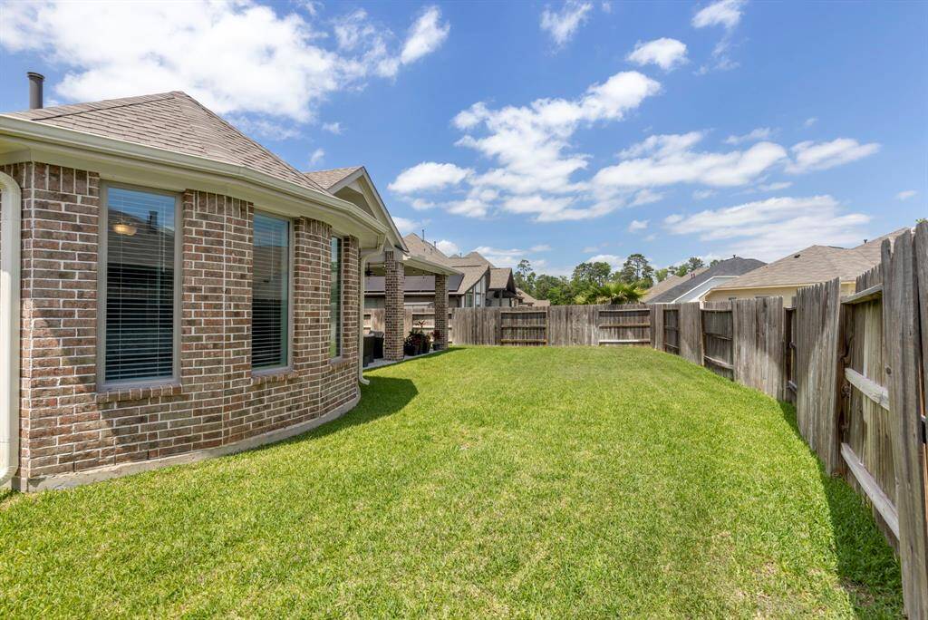 The large yard offers endless possibilities for outdoor activities
