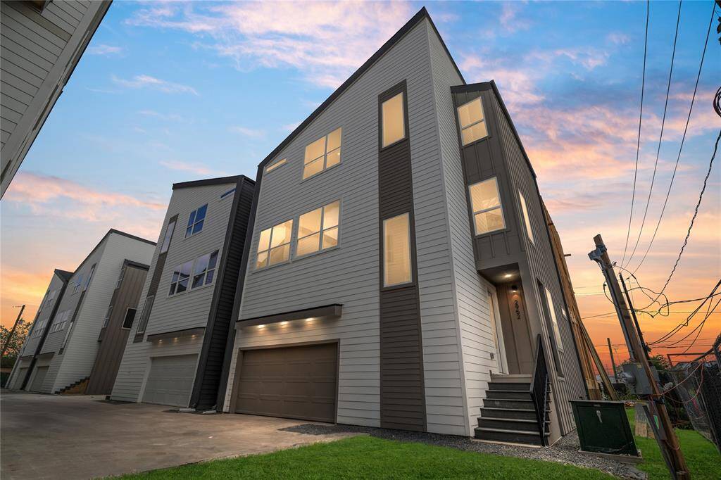 THIS IS THE CORNER MODEL UNIT AND NOT THE INTERIOR UNIT LISTED. A harmonious blend of contemporary design and classic proportions, the Vecino's front elevation at the Delafield Project showcases clean lines and balanced symmetry.