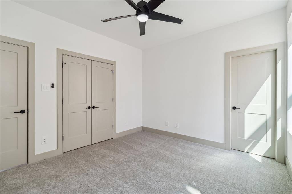 Flush baseboards, modern doors, and clean finishes reinforce the home's minimalist architecture with quiet strength.