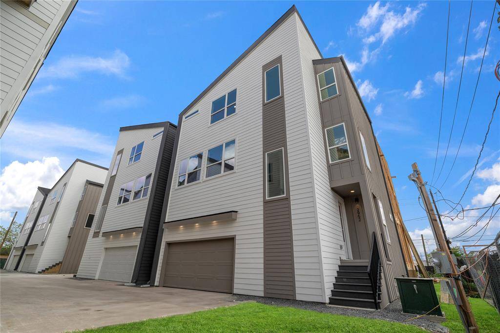 Clean elevation lines meet the convenience of a private entry and garage—urban living redefined in Delafield.