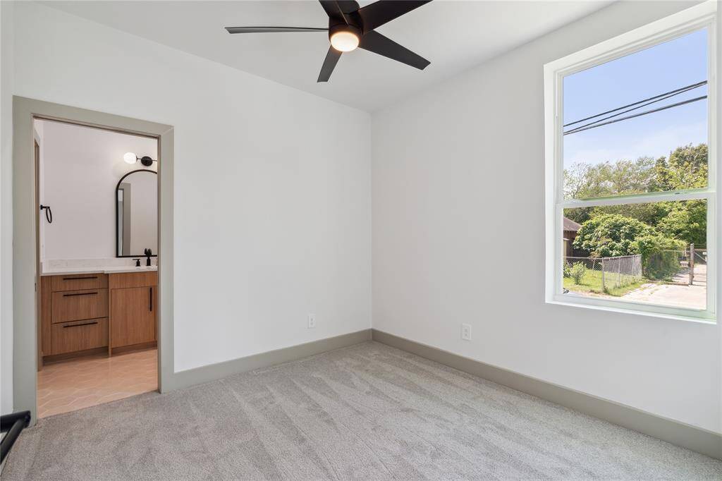 Ample natural light enhances the room's serene ambiance, creating a restful environment for visitors.