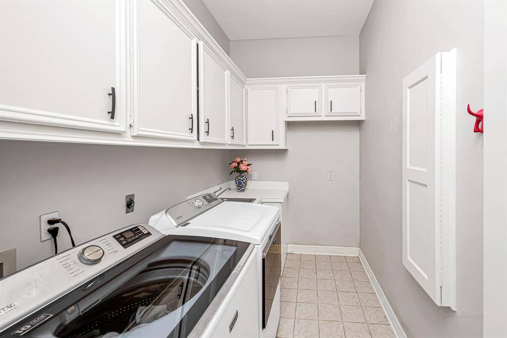 Yes, an extra sink in the laundry room with a built in Ironing board, plenty of storage and room for an frig or freezer!