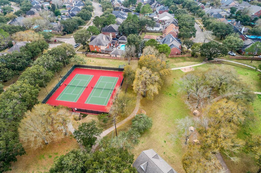 Tennis Courts, Park and walking trails around lakes are also steps away from this Home