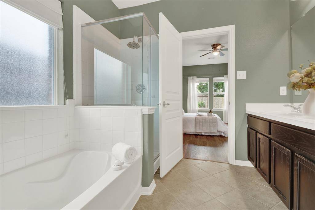 A seamless transition leads to the ensuite bathroom, where luxury and convenience meet.