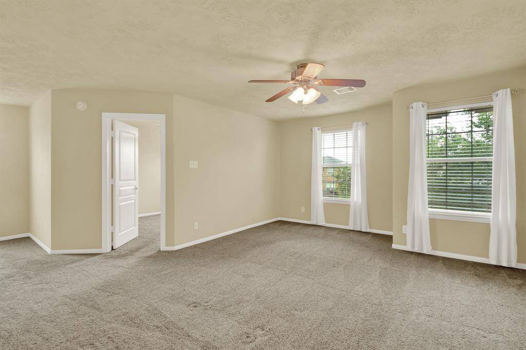 Positioned at the heart of the upper level, this loft provides an additional living area that supports everyday life with ease. Surrounded by the three upstairs bedrooms, it offers a shared space that can evolve with your needs.
