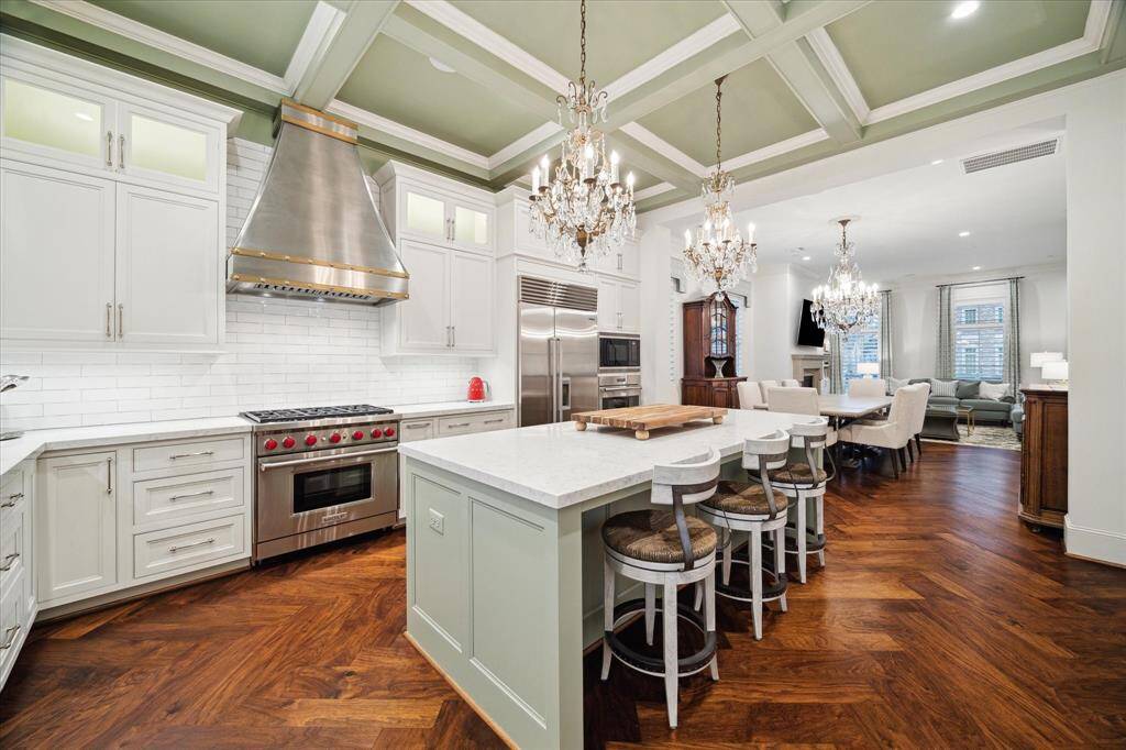 A luxurious kitchen with top-of-the-line appliances truly elevates the entire cooking experience! High-end appliances, a built-in refrigerator, and a quiet dishwasher, not only add sleek sophistication but also offer exceptional performance. Spacious kitchen with a Sub-Zero fridge, a Wolf range, and wine fridge, making cooking and entertaining an absolute joy.