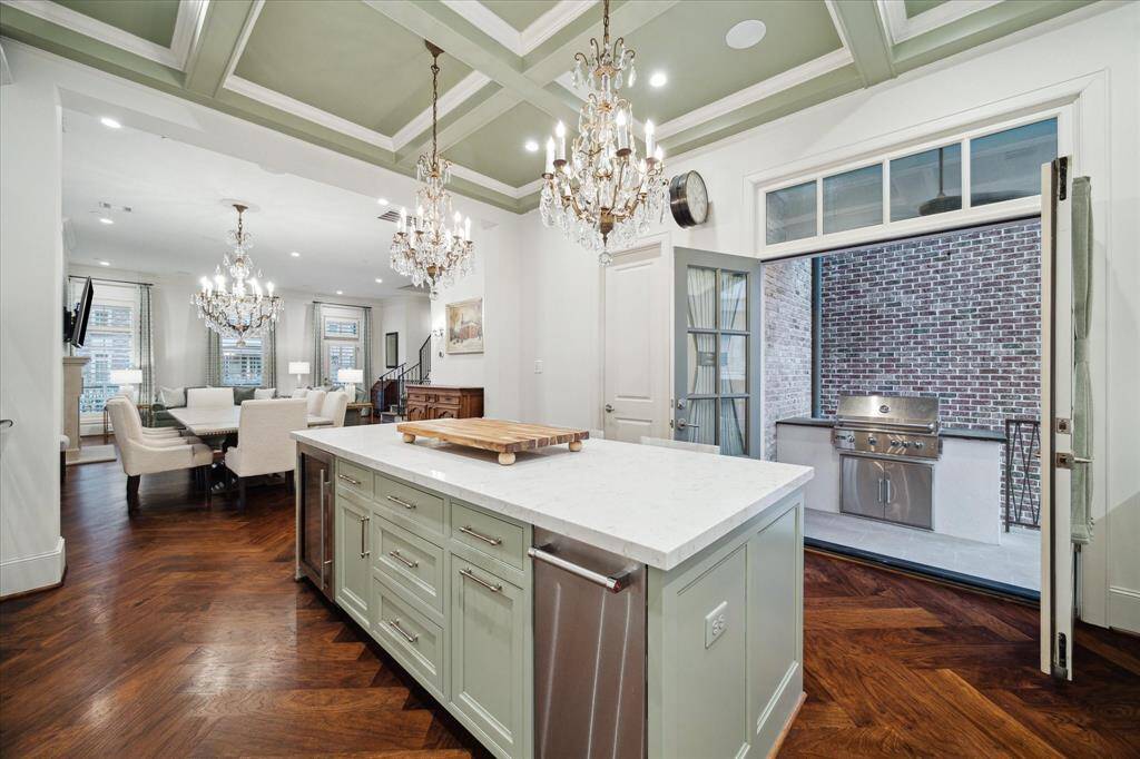 Ample counter space, and custom cabinetry. The addition of an outdoor luxury barbecue takes it to the next level. Ice maker and wine fridge together, these appliances elevate the kitchen to a whole new level of convenience and luxury.