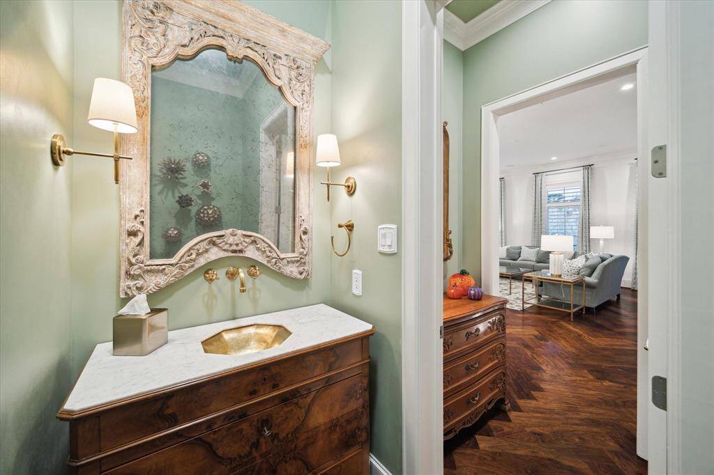 Located on the second floor the luxurious powder bath offers a stylish and sophisticated space for guests.