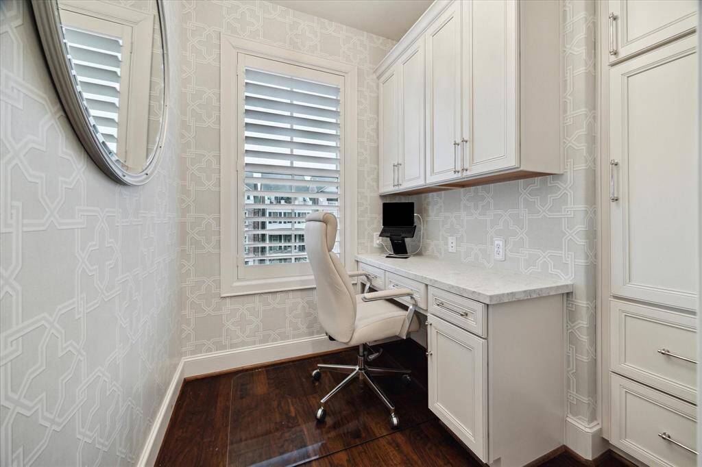 A private office just off the Primary Suite is an ideal space for both focus and relaxation. With plenty of storage, everything would stay organized and clutter-free